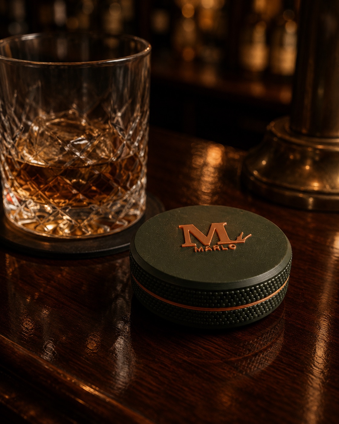 A MARLO tin on the clubhouse bar beside a bourbon