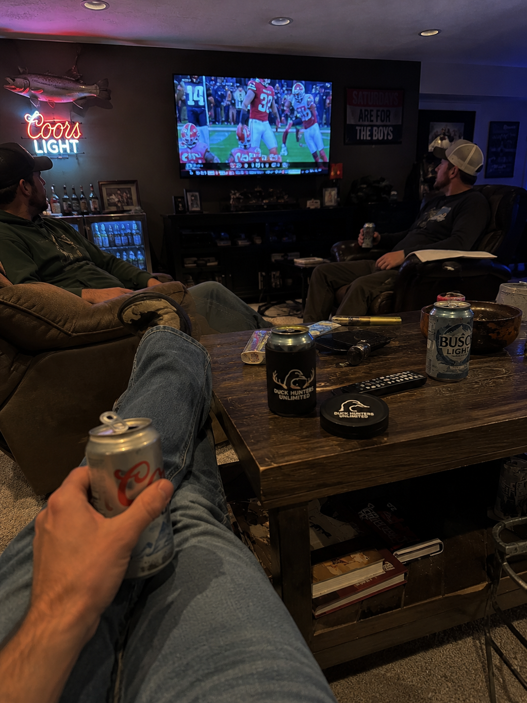 Custom club-logo tin at the Sunday watch party